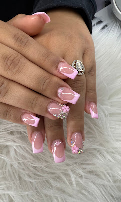 Pink French-tip nails with 3D flowers and rhinestones
