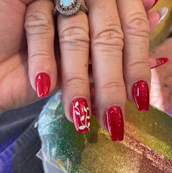 Red nails with candy-cane accent