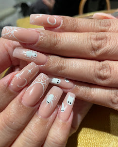 Nude nails with celestial white design