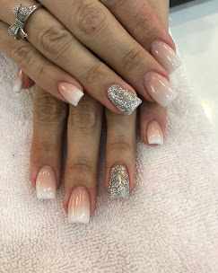 Nude pink ombre nails with glitter accent