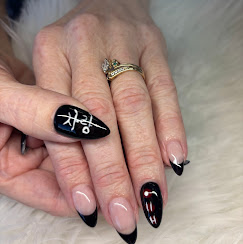 Black nails with gold accent detail